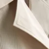 Çift sıra düğmeli, kutu kesim yağmurluk Çift sıra düğmeli, kutu kesim yağmurluk