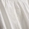 Pamuklu işlemeli geniş paça pantolon Pamuklu işlemeli geniş paça pantolon